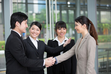 Business people shaking hands.