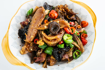 A plate of cured chicken with fungus mushrooms