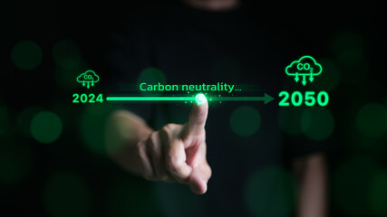 Carbon neutrality concept. Hand touching increasing arrow with carbon reduction for decrease CO2 or carbon neutral by 2050. Carbon footprint, Net Zero, Climate change, Global warming, CO2 emissions, - obrazy, fototapety, plakaty