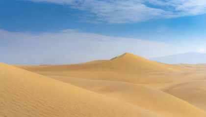   The image depicts a serene desert landscape with rolling sand dunes. The dunes are illuminated by...