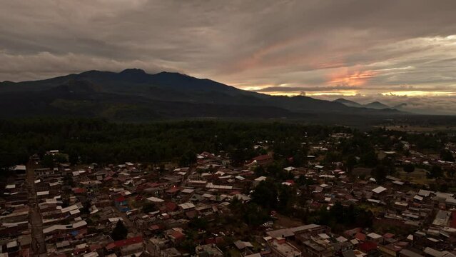 PARICUTIN VOLCANO AT SUNSET WITH ANGAHUAN TOWN 