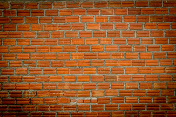 Red bricks, used for construction, walls, have a rough surface, are arranged alternately, beautiful.