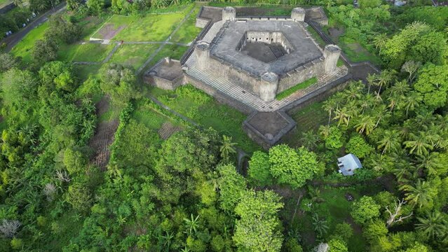 Revealing drone view of Banda Island Fort and Volcano
