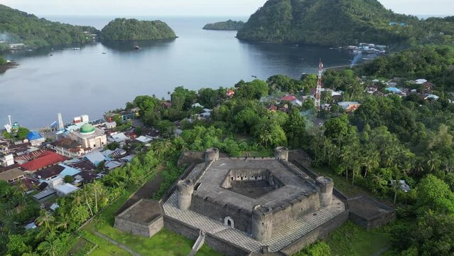 Orbital drone view of Banda Neira Fort and harbour bay