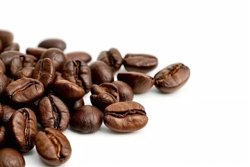 Fototapeta premium Rich roasted coffee beans on white background isolated. Close up view of brown caffeine goodness perfectly capture aroma and flavor in studio setting ideal for enthusiasts and food photography