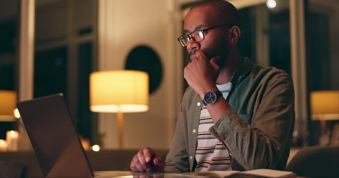 Man, thinking on laptop and work from home research at night for information technology, coding or software. Freelancer or programmer with glasses on computer for online solution and web programming