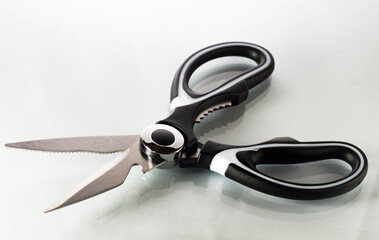 Single kitchen scissors on a white background