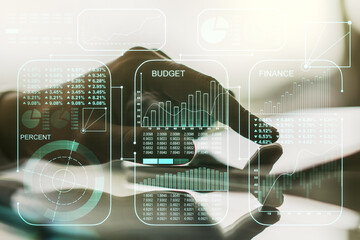 Double exposure of abstract creative statistics data hologram with finger clicks on a digital tablet on background, analytics and forecasting concept