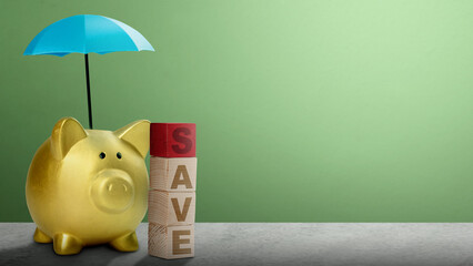 Piggy bank with small blue umbrellas above them and wooden cube with save text