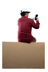 People in hat sit on the large packet for delivery while using mobile phones