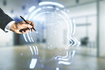 Man hand with pen working with abstract virtual artificial Intelligence interface with human head...