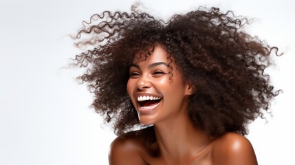 Close-up of beautiful black African American young model woman shaking her beautiful afro hair in motion. Ad for shampoo, conditioner or hair products. Isolated on white background