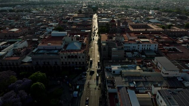  DRONE SHOT: DOWNTOWN MORELIA STREETS AT SUNSET 