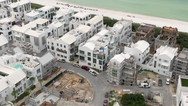Spin to the right Alys beach Florida white houses under construction next to ocean side