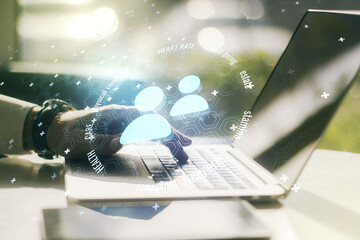Double exposure of people icons hologram and hands typing on laptop on background. Online insurance...