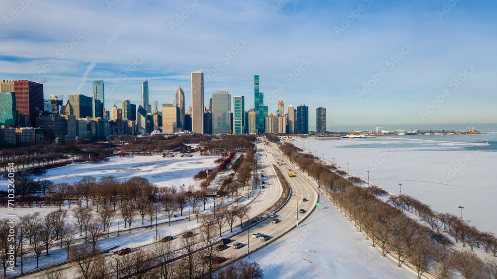 Wall mural Chicago, IL USA January 15th 2024: Aerial drone footage of Chicago downtown  during winter time with below zero temperatures.  the area is empty due to cold weather 