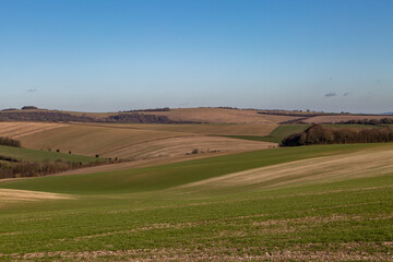 Obraz premium Looking out over farmland in the South Downs, on a sunny winter's day