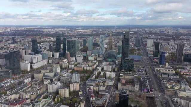 Wide circling aerial shot of modern Warsaw looking towards the city centre