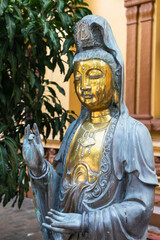 Buddha bronze statue. Gangaramaya Temple, Colombo, Sri Lanka