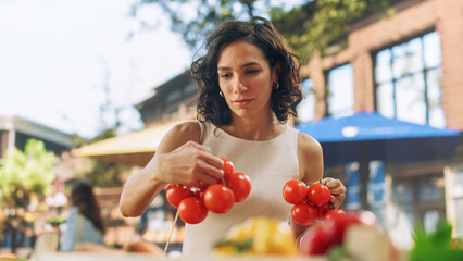 Young Beautiful Customer Shopping for Fresh Seasonal Fruits and Vegetables for a Mediterranean Dinner. Black Female Buying Sustainable Bio Tomatoes From an Ecological Local Street Vendor