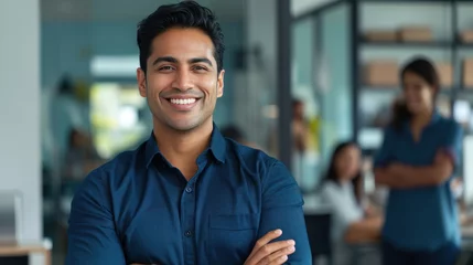 Foto op Canvas Portrait of a handsome smiling asian indian businessman boss standing in his modern business company office. © Farnaces