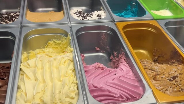 ice cream parlor ice cream display with variety of flavors on the trays