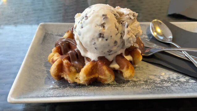 waffle with milk chocolate and stracciatella ice cream freshly prepared and ready to eat