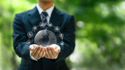 ESG environment social governance concept. Businessman Hand Holding Globe with Environment icon to ...