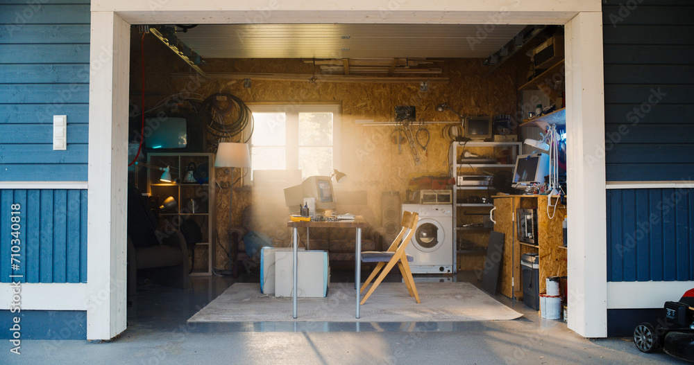 Poster Establishing Shot Of Empty Workplace With Old Desktop Computer In Retro Garage With Random Home Appliances. First Office Of Successful Computer Engineering Startup In Nineties. Nostalgia Concept.