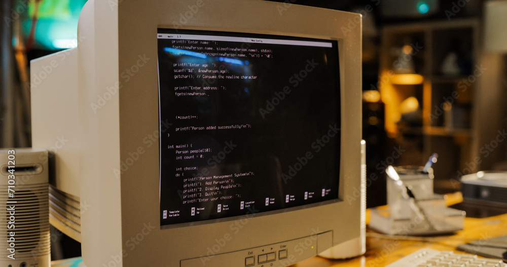 Poster Close Up Shot Of Old Desktop Computer On Work Desk Of Software Developer In Retro Garage. Dated PC Has Operating System Terminal Opened, Prompts Running On Screen, Code Functioning Successfully.