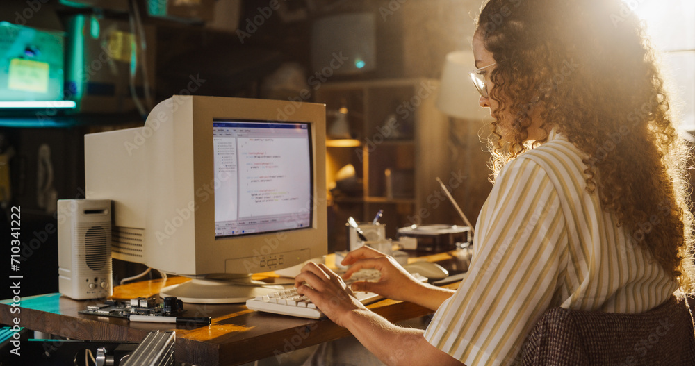 Aufkleber side view of hispanic female engineering student writing academic thesis on old desktop computer in 
