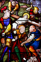 Saint Leonard church.  Stained glass.  Way of the cross. Station 11. Jesus is nailed to the Cross. Honfleur. France.