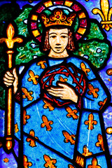 Obraz premium Saint Helier church. Stained glass by Francois Decorchemont. Louis IX of France ( Saint Louis ) with crown of thorns. Bleuzeville. France.