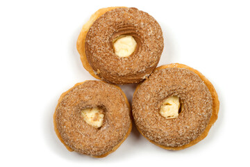 Three round cakes with cream on a white background. Sweet, delicious cookies.