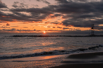 Sunrise from the Atlantic Ocean over the jetty