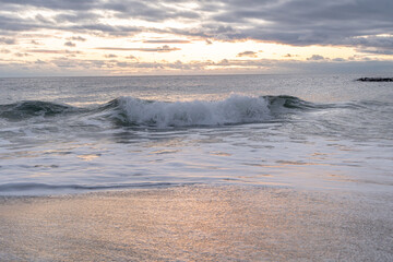 Atlantic Ocean waves crashing ashore onto the beach