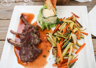 grilled lamb chops served in a restaurant