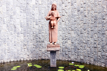 Virgin Mary and child sculpture. Asian style. ..