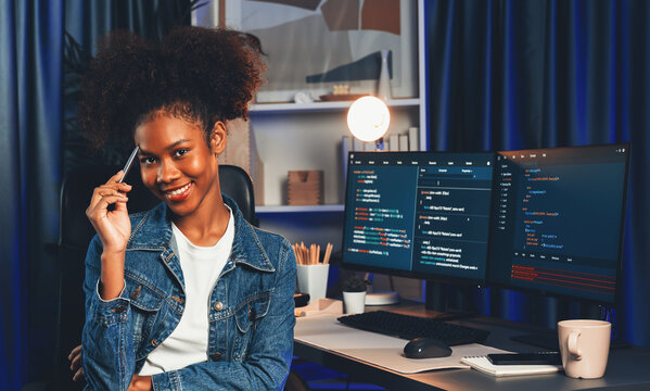 Young African Wearing Jeans Shirt, IT Developer Presenting Program On Computer Screens Displaying Coded Data Of Application And Website, Creating Innovative Updated Software Version. Tastemaker.