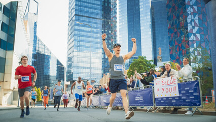 Portrait of a Smiling Group of People Participating in a City Marathon. Wide Shot of Diverse Race...