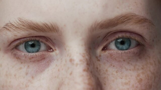 Portrait of Young Woman Face with Wide Eyes Looking at Camera Close Up. Serious Future Vision of One Caucasian Girl with Youth Features. Modern Concept of Good Sighted Young Person Gazing and Thinking