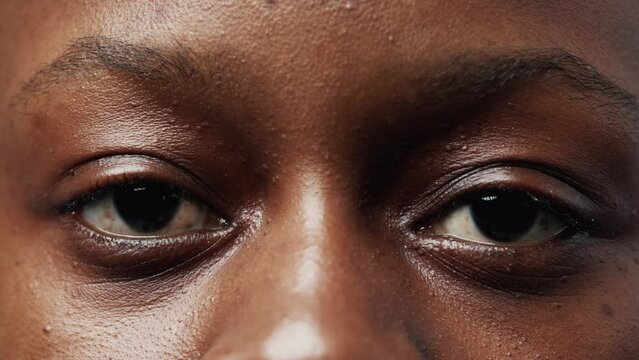 Portrait of Black Woman Face with Wide Eyes Looking at Camera Close Up. Serious Vision of African American Girl with Ethnic Features. Modern Concept of One Good Sighted Young Person Gazing in Future