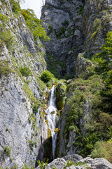 Fototapeta na wymiar waterfall river comes down from the mountain in Lescun Pyrenees in France Europe