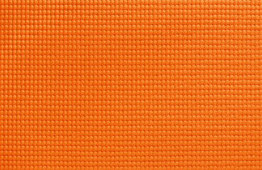 Orange yoga mat texture, pattern of rubber for background.
