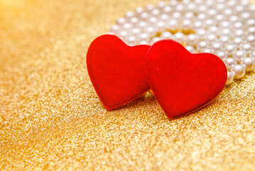 Heart symbol on a gold shiny background