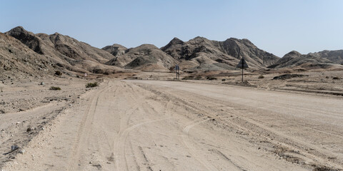 gravel road and barren slopes at Moonlandscape, near Swakopmund, Namibia
