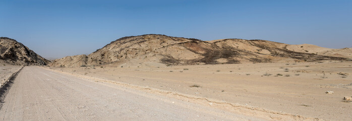 basalt stones on barren slopes  in hilly landscape at Moonlandscape, near Swakopmund, Namibia