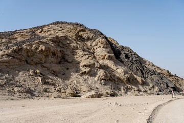 Fototapeta na wymiar hill with barren slopes and basalt stones at Moonlandscape, near Swakopmund, Namibia