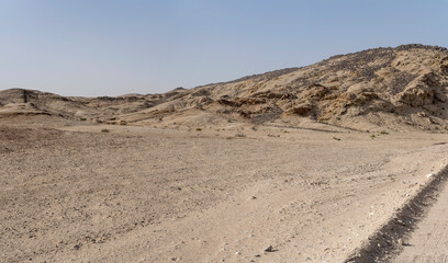 barren slopes and basalt stones in hilly landscape at Moonlandscape, near Swakopmund, Namibia