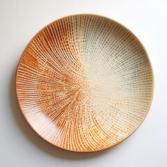 Decorative ceramic painted plate, handmade, isolated, closeup top view.